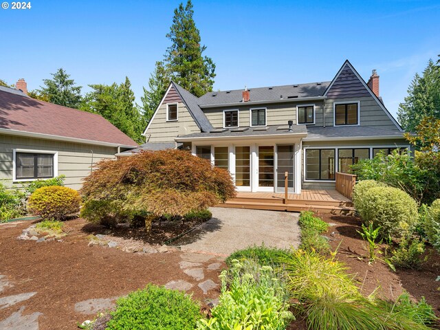 rear view of house with a wooden deck