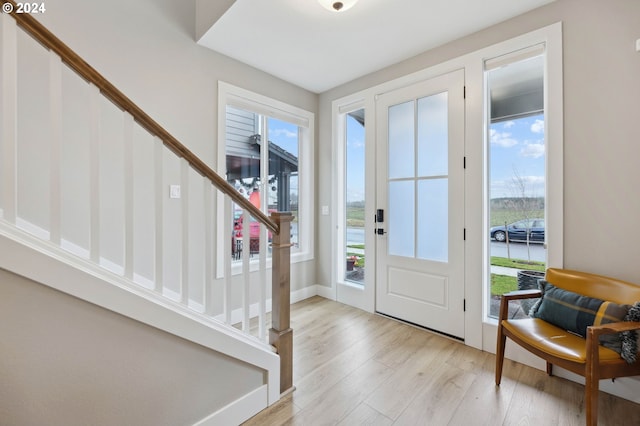 entrance foyer featuring light hardwood / wood-style floors and a wealth of natural light