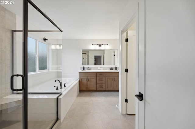 bathroom featuring vanity, plus walk in shower, and tile patterned flooring