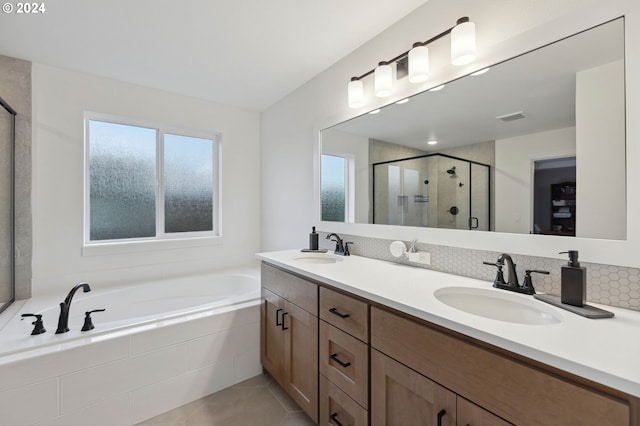 bathroom with vanity, tile patterned floors, and independent shower and bath