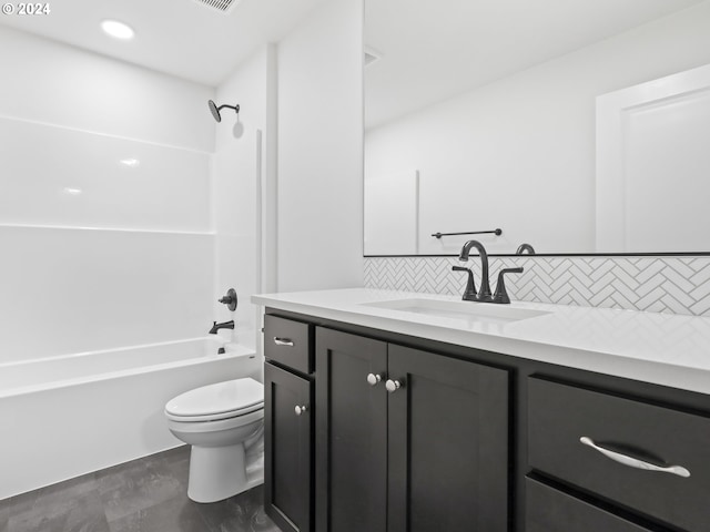 full bathroom featuring tasteful backsplash, vanity, shower / bath combination, and toilet