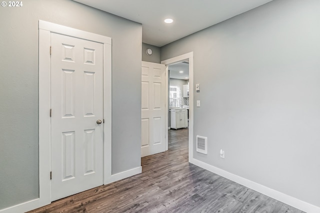 interior space featuring light wood finished floors, recessed lighting, visible vents, and baseboards