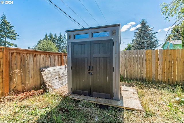 view of shed with a fenced backyard