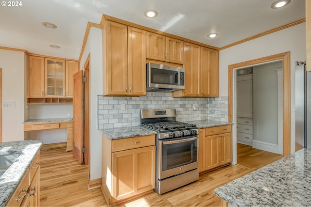 kitchen with light hardwood / wood-style floors, light stone counters, tasteful backsplash, stainless steel appliances, and ornamental molding