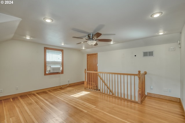 bonus room with cooling unit, lofted ceiling, hardwood / wood-style floors, and ceiling fan