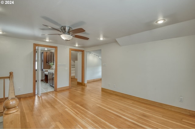 unfurnished room with wood-type flooring and ceiling fan