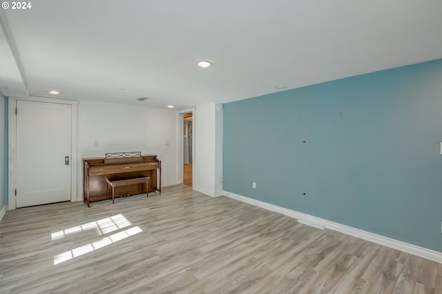 unfurnished room with light hardwood / wood-style floors