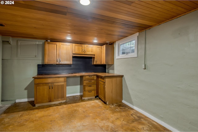 kitchen featuring backsplash, built in desk, and wooden ceiling