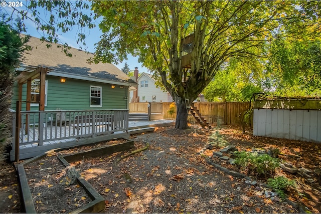 view of yard with a wooden deck