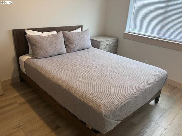 bedroom with light hardwood / wood-style flooring