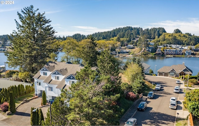 birds eye view of property with a water view