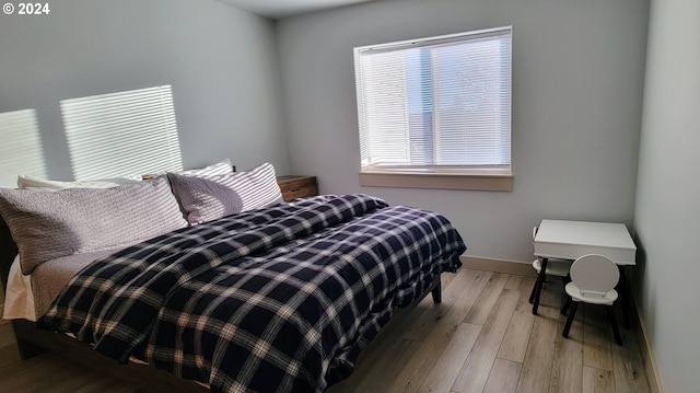 bedroom with light wood-type flooring