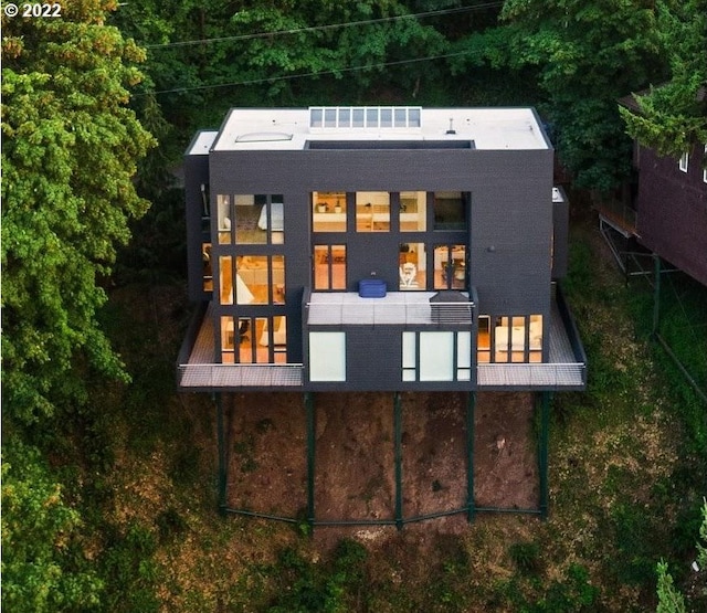 rear view of house featuring a balcony