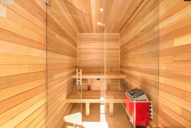 view of sauna featuring wood walls