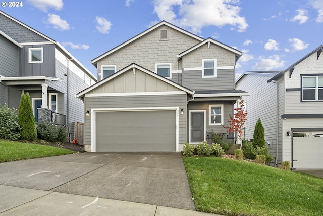 craftsman house featuring a garage and a front yard