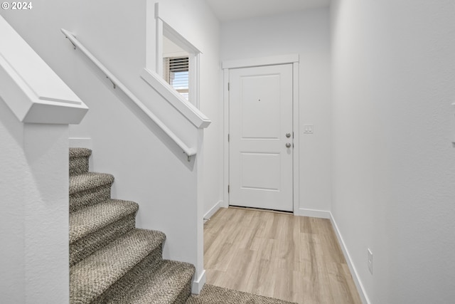 entrance foyer with light hardwood / wood-style flooring