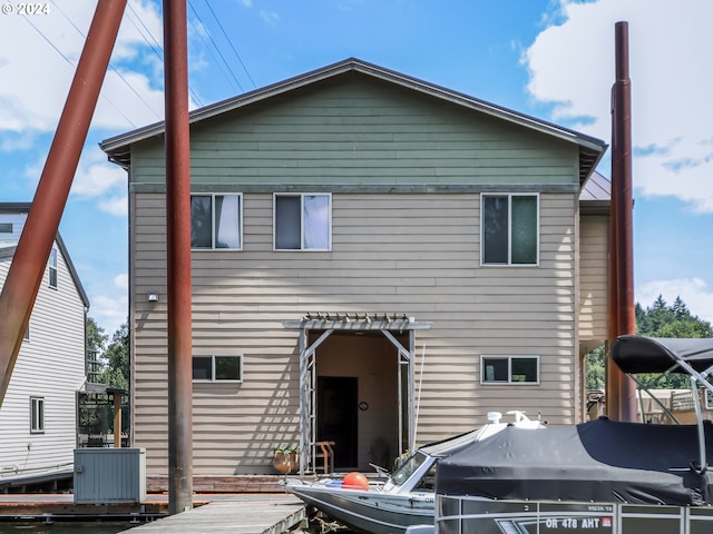 rear view of property with a wooden deck