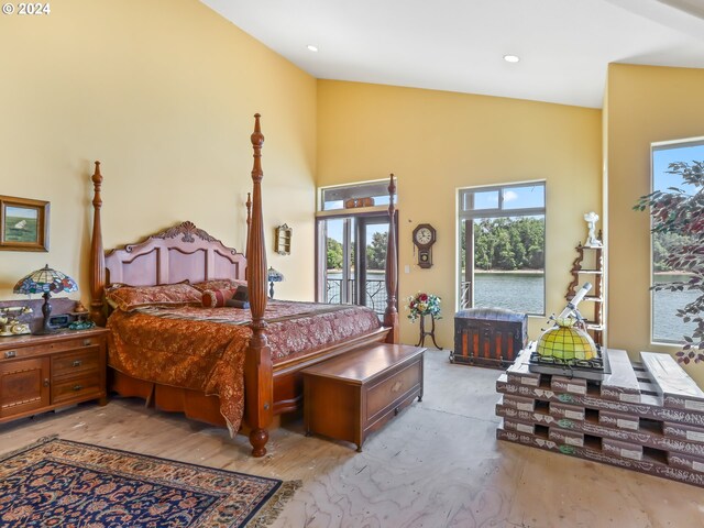 bedroom featuring access to exterior and lofted ceiling