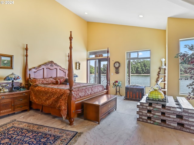 bedroom featuring access to outside and high vaulted ceiling