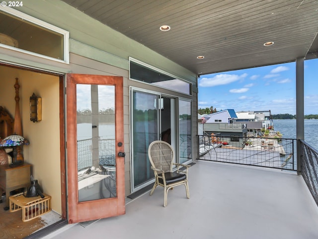 balcony featuring a water view