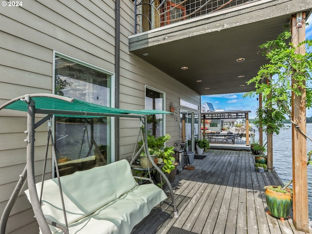 wooden terrace with a water view