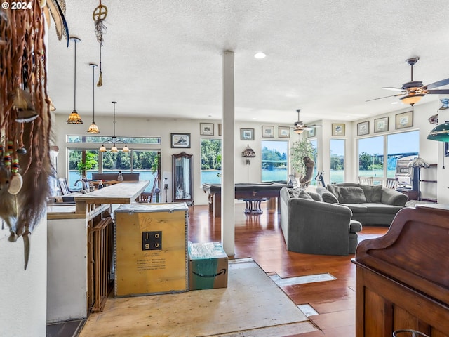 kitchen featuring hardwood / wood-style flooring, a textured ceiling, pool table, and ceiling fan