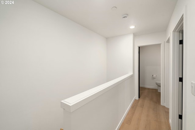 6061 NE Simpson St, Portland, OR 97218 - hallway with light wood-style flooring, recessed lighting, and an upstairs landing