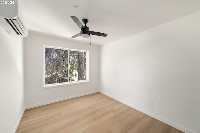 6061 NE Simpson St, Portland, OR 97218 - unfurnished room with a wall mounted air conditioner, wood finished floors, and ceiling fan