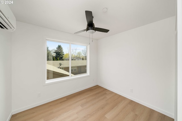 6061 NE Simpson St, Portland, OR 97218 - unfurnished room with an AC wall unit, light wood finished floors, and ceiling fan