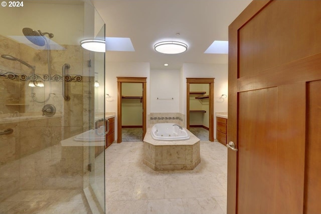 bathroom with plus walk in shower and tile patterned floors