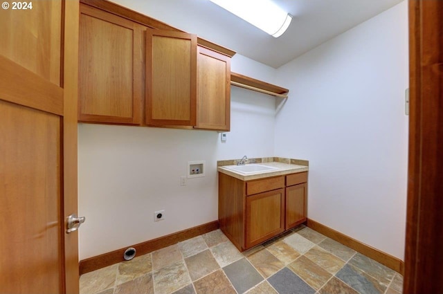 washroom with washer hookup, electric dryer hookup, cabinets, and sink