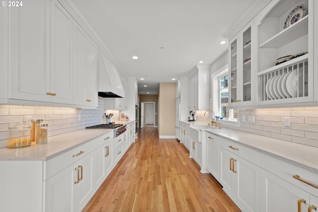 35222 NE 92nd Ct, La Center, WA 98629 - kitchen with a sink, white cabinetry, glass insert cabinets, stainless steel gas stovetop, and light wood-style floors