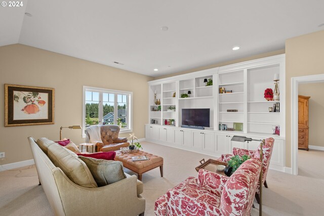 carpeted living room with vaulted ceiling