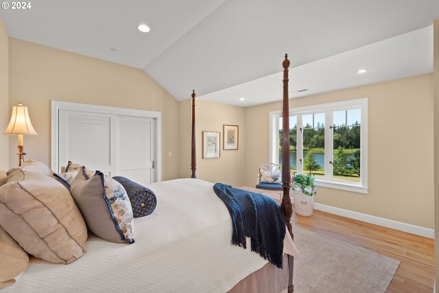 bedroom featuring vaulted ceiling and carpet floors