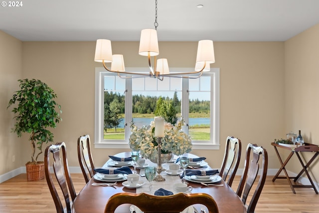 35222 NE 92nd Ct, La Center, WA 98629 - dining area with baseboards, light wood-style flooring, and an inviting chandelier