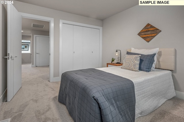 carpeted bedroom featuring a closet