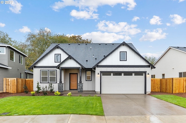 modern inspired farmhouse with a garage and a front lawn