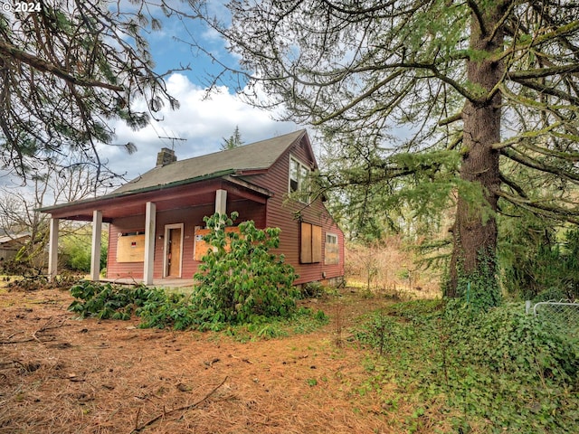 view of home's exterior with covered porch