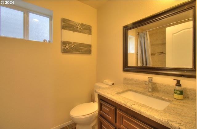 28999 Vizcaino Ct, Gold Beach, OR 97444 - bathroom with toilet, vanity, and curtained shower