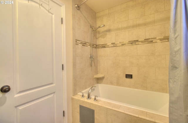 bathroom with shower / bath combo