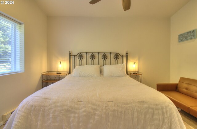 bedroom featuring ceiling fan and hardwood / wood-style flooring