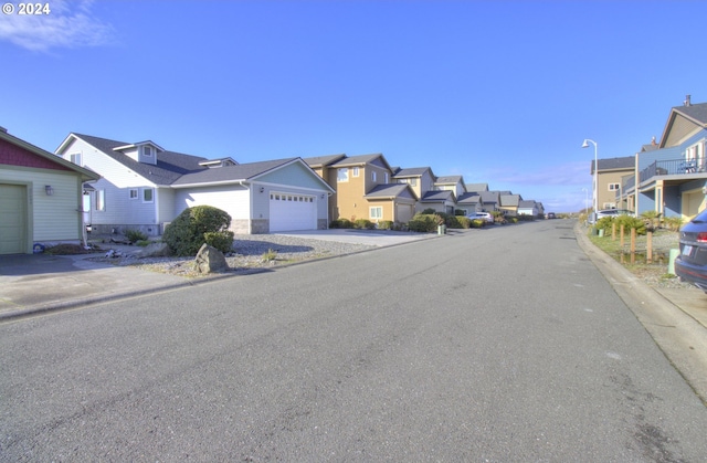 28999 Vizcaino Ct, Gold Beach, OR 97444 - view of asphalt street with a residential view, curbs, and street lights