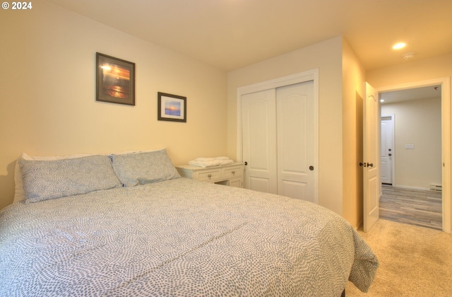 carpeted bedroom with a closet