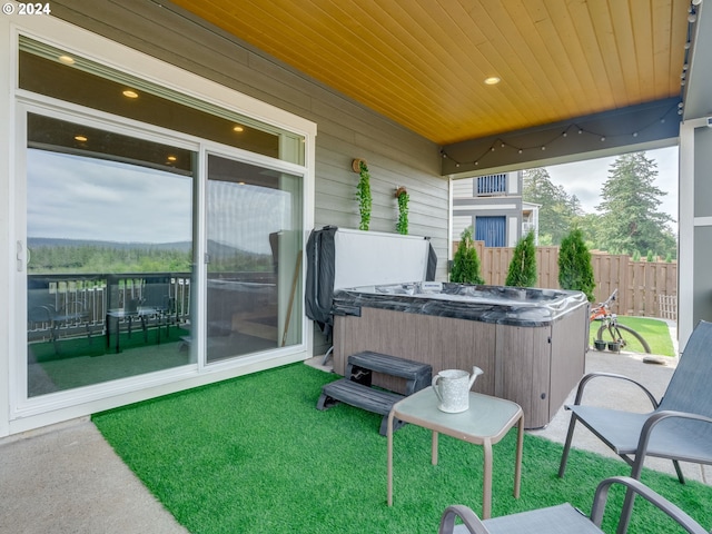 view of patio / terrace featuring a hot tub