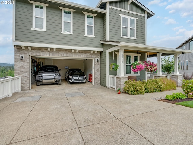 craftsman-style house with a garage and covered porch