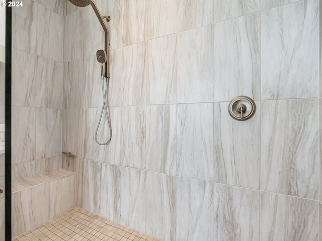 bathroom with a tile shower