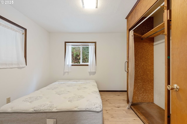 bedroom with light wood-type flooring