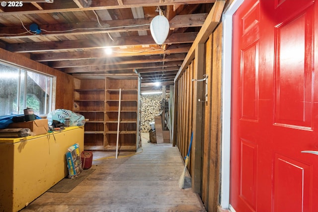 basement featuring hardwood / wood-style flooring and wooden ceiling