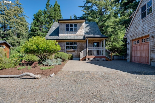 view of front of house featuring a garage and covered porch