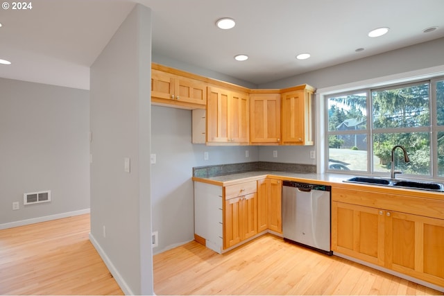 kitchen featuring sink, light brown cabinetry, light hardwood / wood-style floors, and stainless steel dishwasher